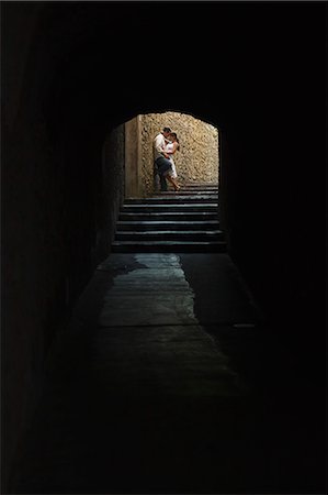 romantic couple silhouette - Italy, Ravello, Mature couple kissing in archway Stock Photo - Premium Royalty-Free, Code: 640-06050101