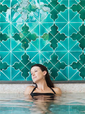 pool, indoor - Italy, Amalfi Coast, Ravello, Mature woman in swimming pool looking away Stock Photo - Premium Royalty-Free, Code: 640-06050137