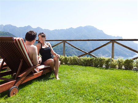 Italy, Amalfi Coast, Ravello, Mature couple sitting on lounge chair Stock Photo - Premium Royalty-Free, Code: 640-06050168