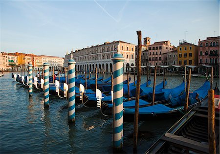 Italy, Venice, Row of blue gondolas moored at pier Stock Photo - Premium Royalty-Free, Code: 640-06050215