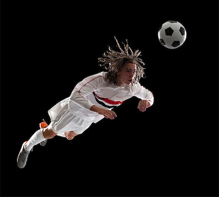 Soccer player heading the ball Stock Photo - Premium Royalty-Free, Code: 640-06050648