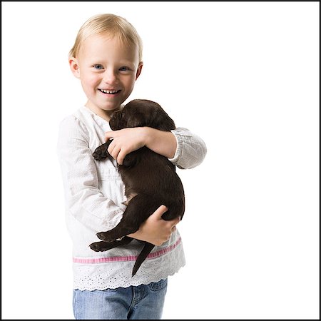 puppy with child white background - child with a puppy Stock Photo - Premium Royalty-Free, Code: 640-06050834