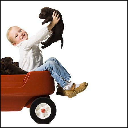 puppy with child white background - child with a puppy Stock Photo - Premium Royalty-Free, Code: 640-06050837