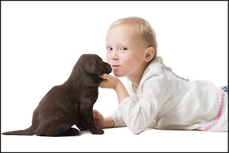 puppy with child white background - child with puppy Stock Photo - Premium Royalty-Free, Code: 640-06050845