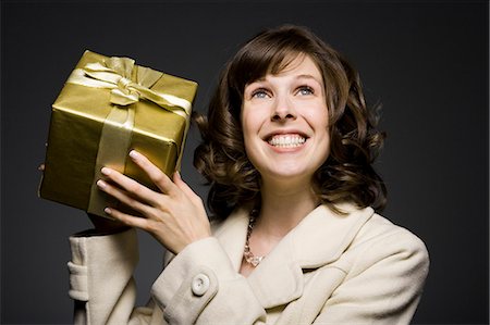 woman holding a gift Stock Photo - Premium Royalty-Free, Code: 640-06050863