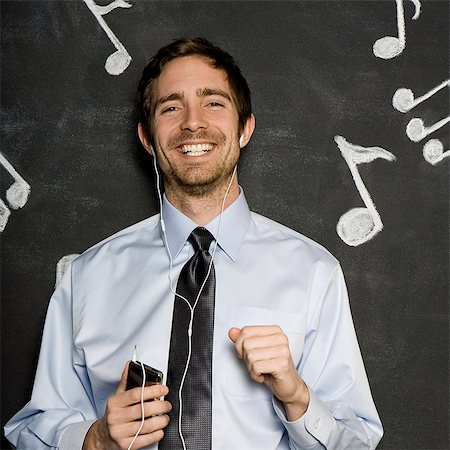 homme à l'écoute d'un lecteur mp3 Photographie de stock - Premium Libres de Droits, Code: 640-06050875