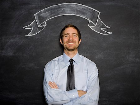 man against a blackboard Stock Photo - Premium Royalty-Free, Code: 640-06050885