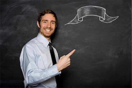 man against a blackboard Stock Photo - Premium Royalty-Free, Code: 640-06050883