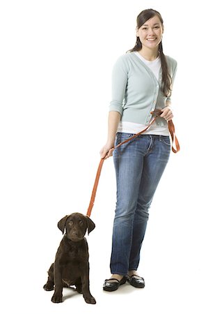young woman with a brown puppy Stock Photo - Premium Royalty-Free, Code: 640-06051028