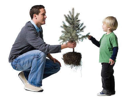 father and son planting a tree Stock Photo - Premium Royalty-Free, Code: 640-06051046