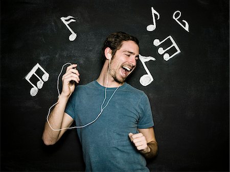 man against a chalkboard Foto de stock - Sin royalties Premium, Código: 640-06051120