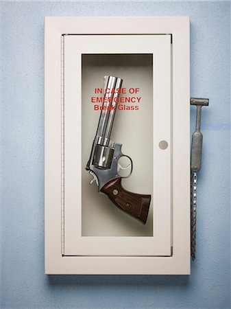 revolver - hand gun in a emergency case Stock Photo - Premium Royalty-Free, Code: 640-06051250
