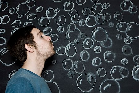 man blowing bubbles Stock Photo - Premium Royalty-Free, Code: 640-06051287