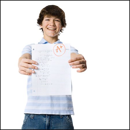 young man showing the grade he received Stock Photo - Premium Royalty-Free, Code: 640-06051394