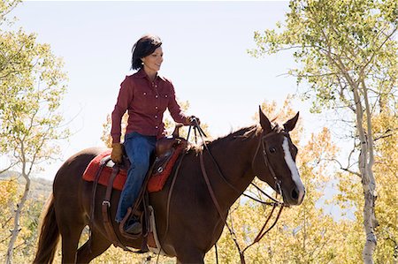 woman riding a horse Stock Photo - Premium Royalty-Free, Code: 640-06051529