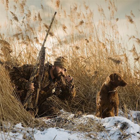 rugged outdoors man - hunter with his dog Stock Photo - Premium Royalty-Free, Code: 640-06051631