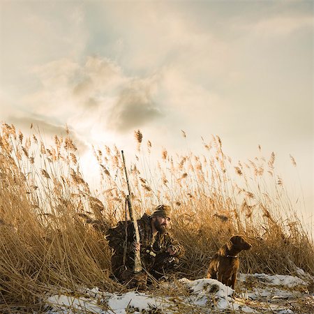 rifling - man and his dog duck hunting Stock Photo - Premium Royalty-Free, Code: 640-06051654