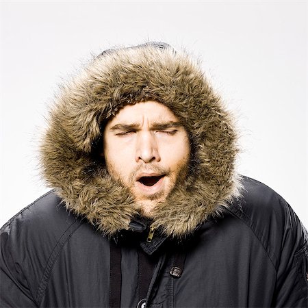 disheveled person - man wearing a winter coat with a fur trimmed hood Stock Photo - Premium Royalty-Free, Code: 640-06051724