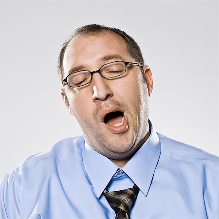 businessman yawning Stock Photo - Premium Royalty-Free, Code: 640-06051760