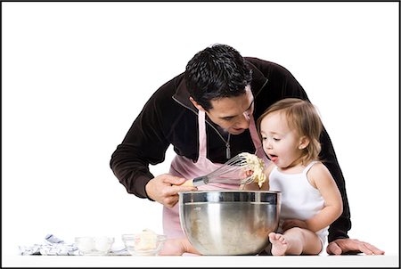 dad apron - father and young daughter Stock Photo - Premium Royalty-Free, Code: 640-06051796