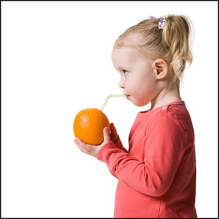 drinking straw not child - child drinking an orange with a straw in it Stock Photo - Premium Royalty-Free, Code: 640-06051877