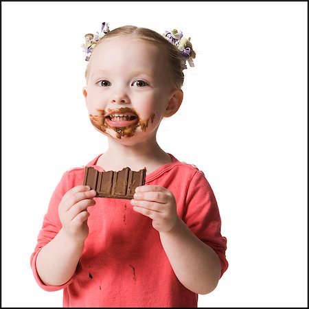 child eating chocolate Foto de stock - Sin royalties Premium, Código: 640-06051889