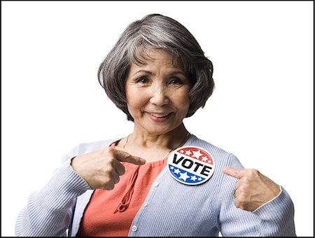 simsearch:640-06051924,k - woman with a "vote" button Stock Photo - Premium Royalty-Free, Code: 640-06051925