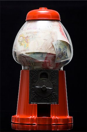 gumball machine full of money Stock Photo - Premium Royalty-Free, Code: 640-06051994