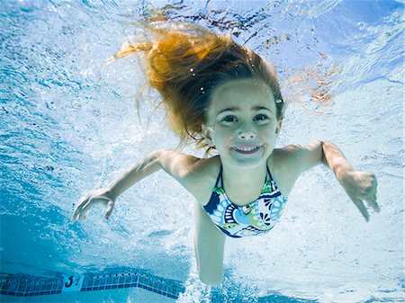 Girl fishing in swimming pool, Stock Photo, Picture And Royalty