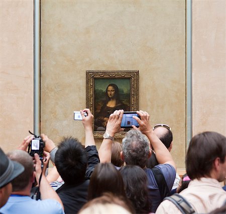 France, Paris, Tourists photographing Mona Lisa painting Photographie de stock - Premium Libres de Droits, Code: 640-06963098