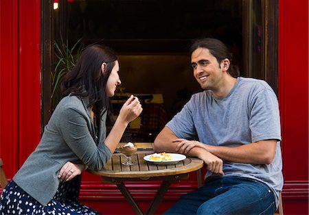France, Paris, Young couple sitting in sidewalk cafe Stock Photo - Premium Royalty-Free, Code: 640-06963108