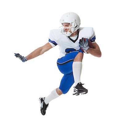 simsearch:640-05760911,k - Male player of American football running with ball, studio shot Photographie de stock - Premium Libres de Droits, Code: 640-06963146