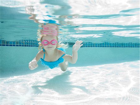 Girl fishing in swimming pool, Stock Photo, Picture And Royalty