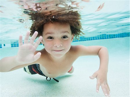 day time underwater - USA, Utah, Orem, Boy (4-5) swimming in pool Stock Photo - Premium Royalty-Free, Code: 640-06963373