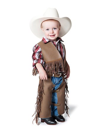 Portrait of boy (12-17 months) in cowboy costume for Halloween Foto de stock - Sin royalties Premium, Código: 640-06963566