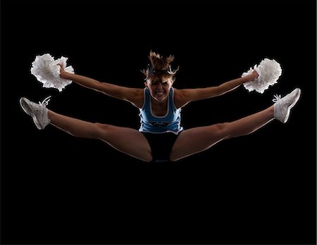 split - Portrait of teenage cheerleader girl (16-17) with legs apart Foto de stock - Sin royalties Premium, Código: 640-06963618