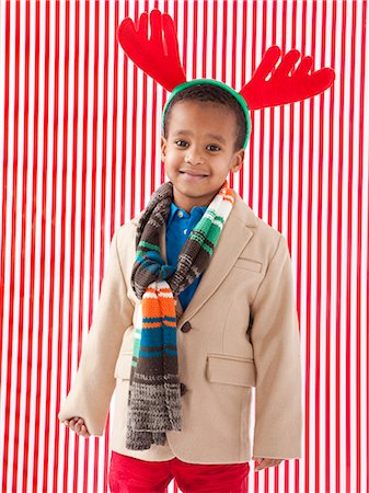 stock picture - Boy (4-5) wearing reindeer antlers, studio shot Stock Photo - Premium Royalty-Free, Code: 640-06963724