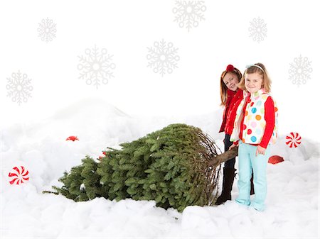 simsearch:640-06963728,k - Two girls (4-5,6-7) pulling christmas tree Foto de stock - Sin royalties Premium, Código: 640-06963737