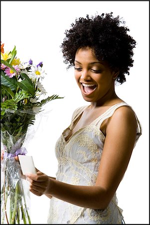 simsearch:640-03260223,k - Woman receiving bouquet of flowers Stock Photo - Premium Royalty-Free, Code: 640-08088957