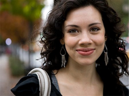 USA, New York, Manhattan, Greenwich Village, Portrait of smiling young woman Stock Photo - Premium Royalty-Free, Code: 640-08088970
