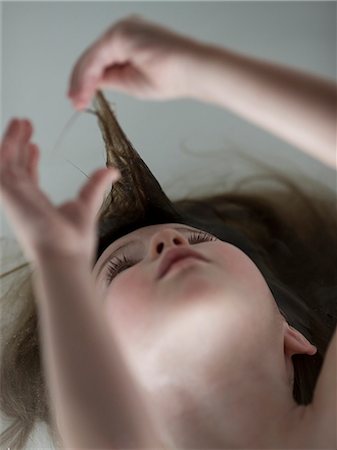 USA, Utah, girl (2-3) with hands in brown hair Stock Photo - Premium Royalty-Free, Code: 640-08089040