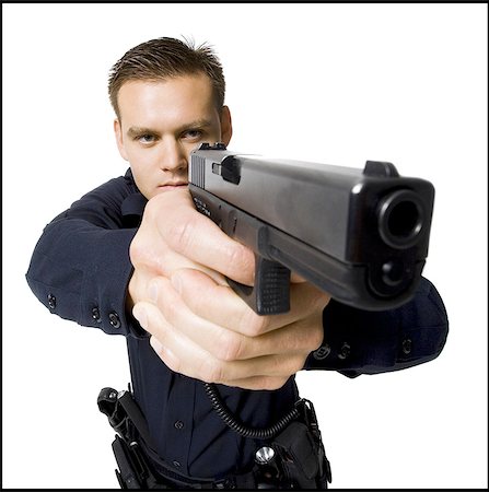 simsearch:640-02952327,k - Male police officer with handgun Fotografie stock - Premium Royalty-Free, Codice: 640-08089077