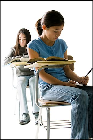 simsearch:640-08089064,k - Two girls at school desks doing written work Photographie de stock - Premium Libres de Droits, Code: 640-08089082
