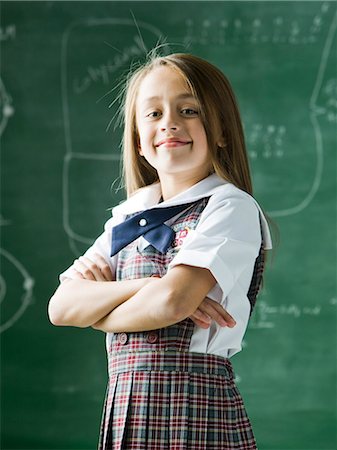 simsearch:640-06963177,k - girl in a classroom standing in front of the chalkboard Photographie de stock - Premium Libres de Droits, Code: 640-08089206