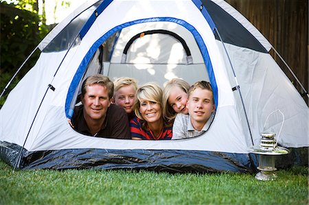 family in a tent in the backyard Stock Photo - Premium Royalty-Free, Code: 640-08089200