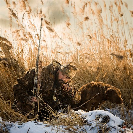 simsearch:640-06052102,k - man and his dog duck hunting Foto de stock - Royalty Free Premium, Número: 640-08089219