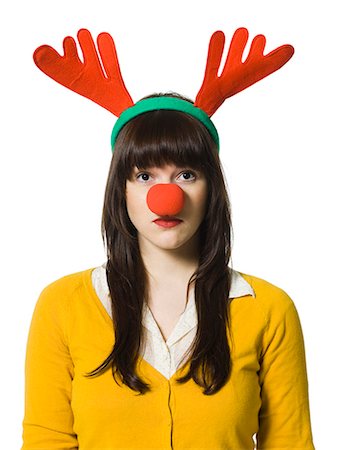 woman wearing reindeer antlers and a red nose Fotografie stock - Premium Royalty-Free, Codice: 640-08089254