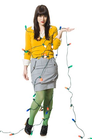 woman wrapped up in christmas lights Foto de stock - Sin royalties Premium, Código: 640-08089251