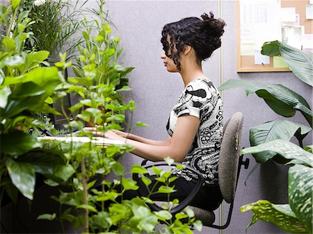 simsearch:640-08089533,k - woman working in her "green" office Stock Photo - Premium Royalty-Free, Code: 640-08089347