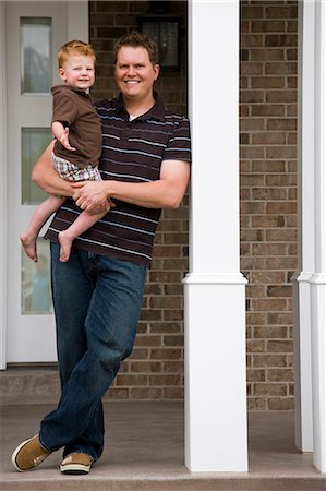 simsearch:640-08089524,k - father standing on front porch holding baby son Stock Photo - Premium Royalty-Free, Code: 640-08089371